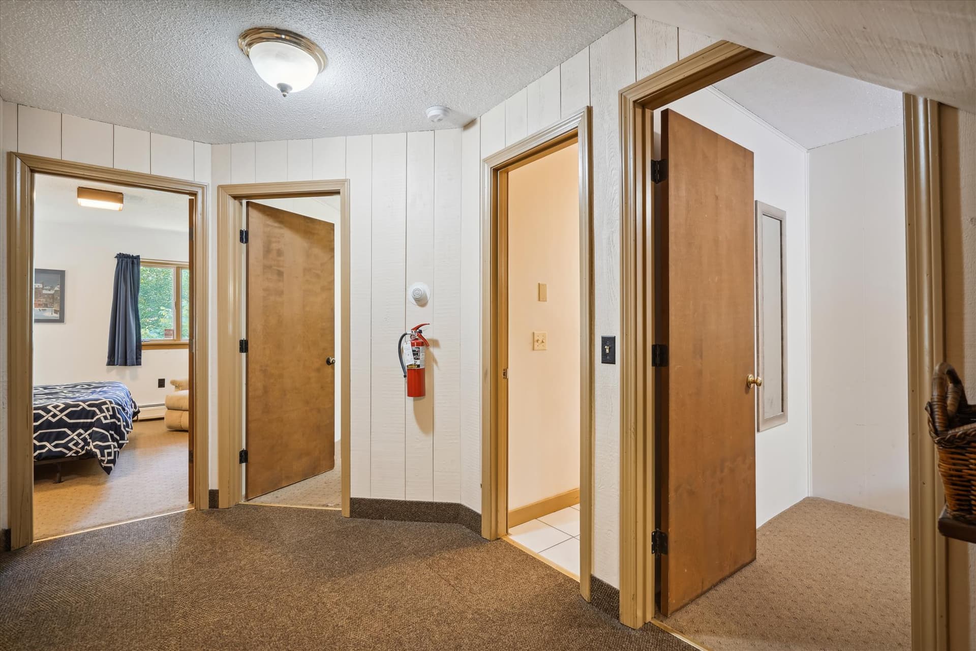 Three bedrooms and a full bathroom w/shower only and sauna.  Small laundry room