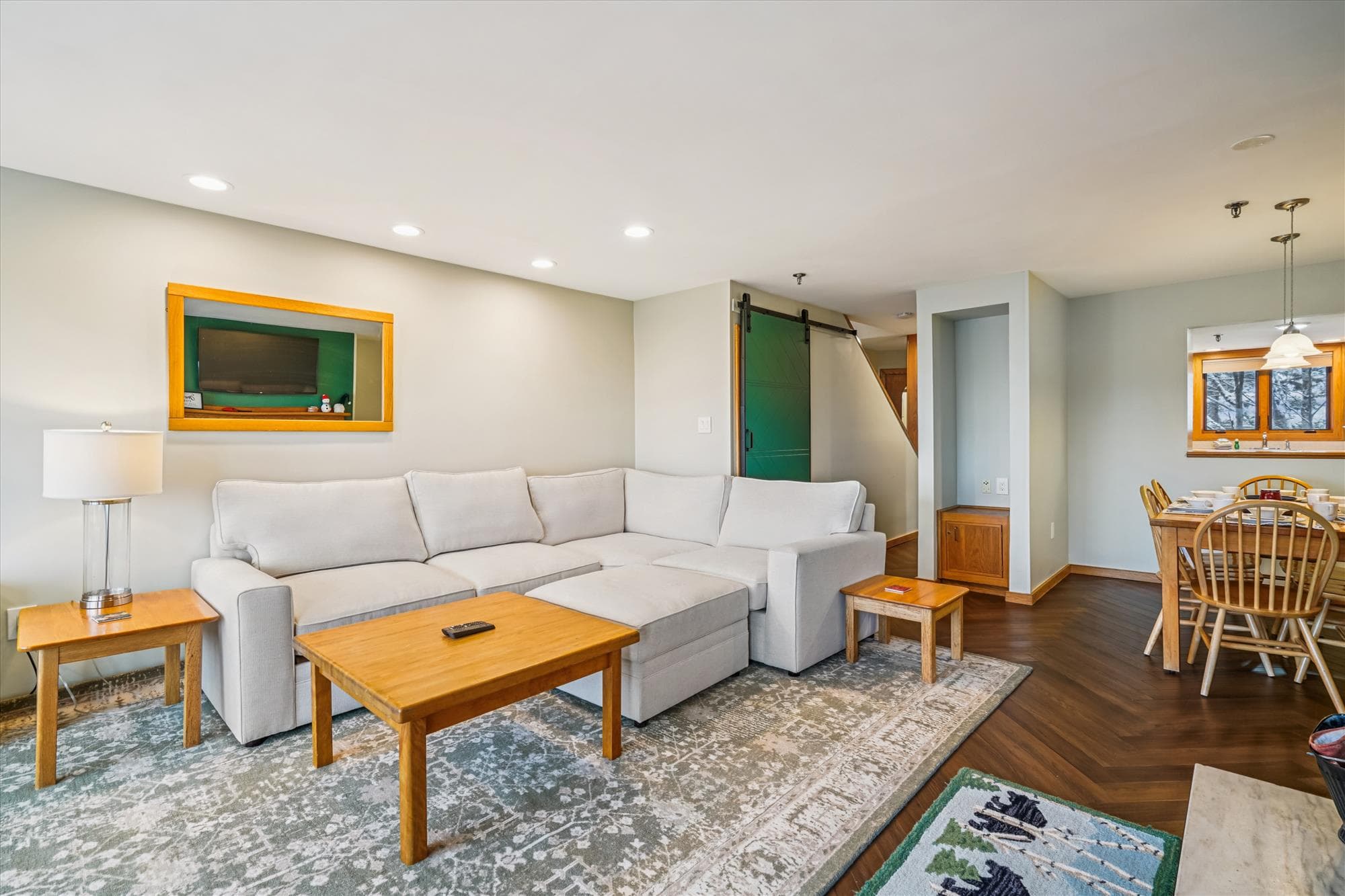 The generous living area provides plenty of comfortable seating and an open layout that flows easily into the dining space and kitchen.