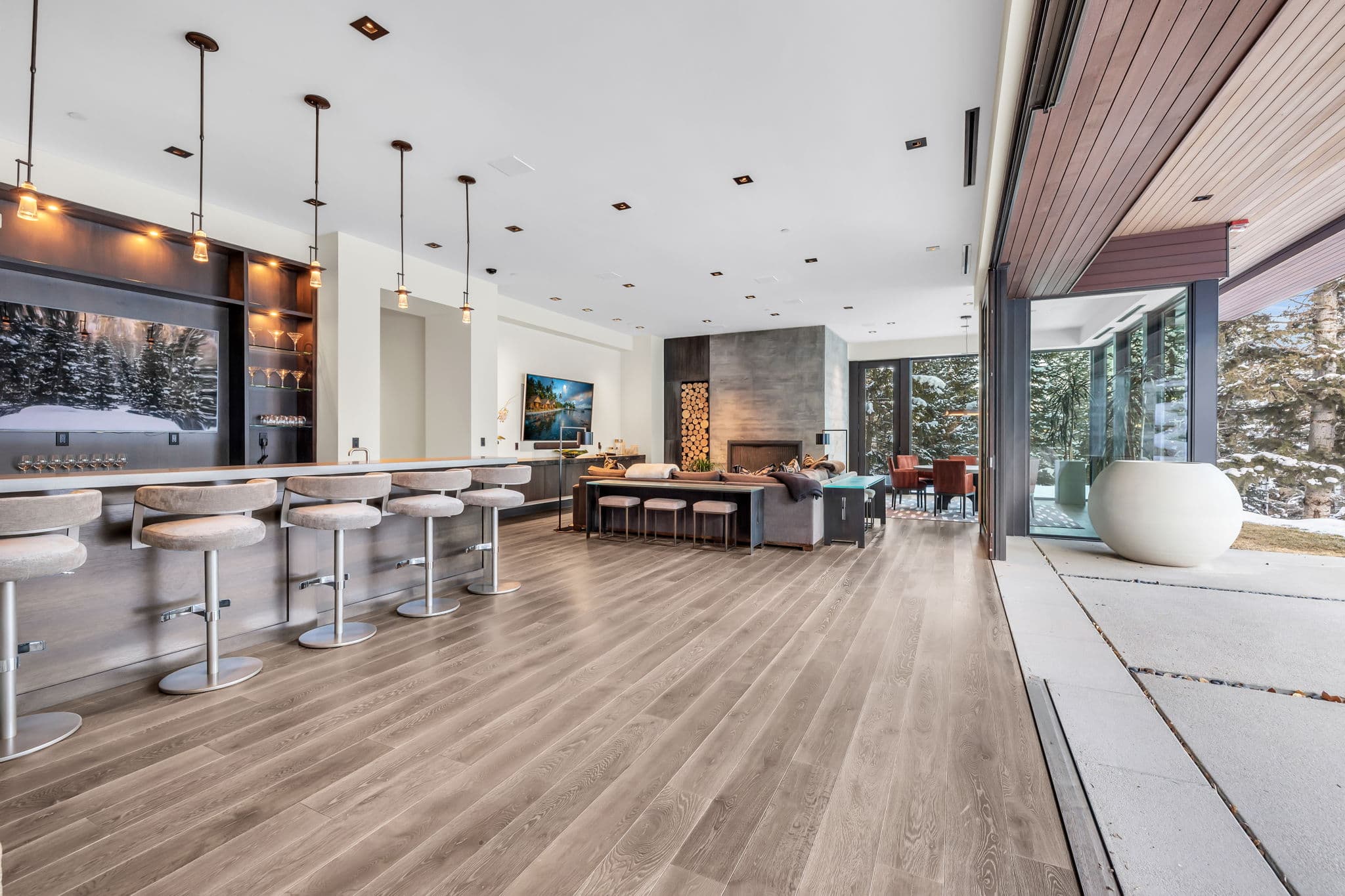 A sleek  bar and lounge with indoor-outdoor flow.