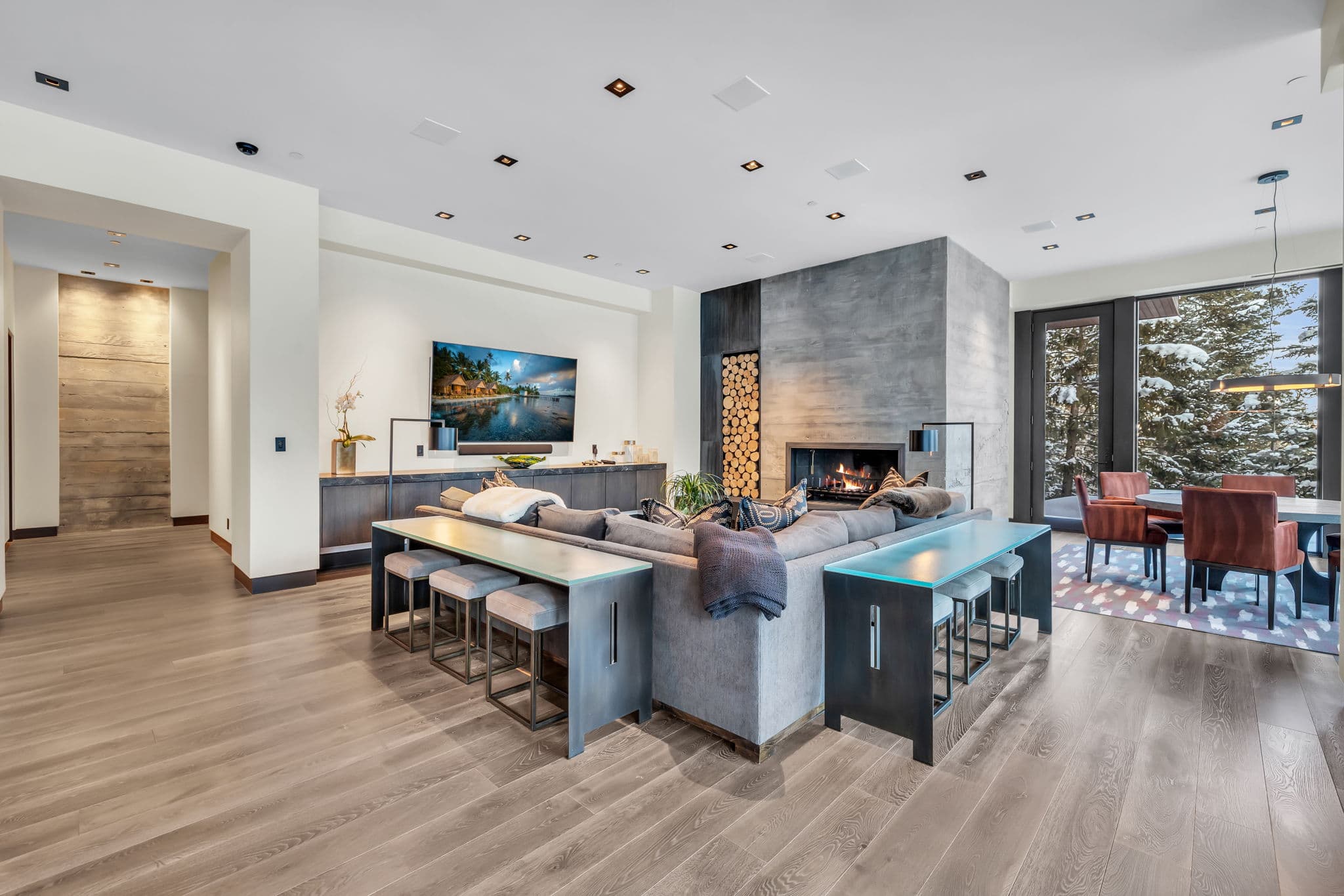A chic  lounge with a modern fireplace and open design.