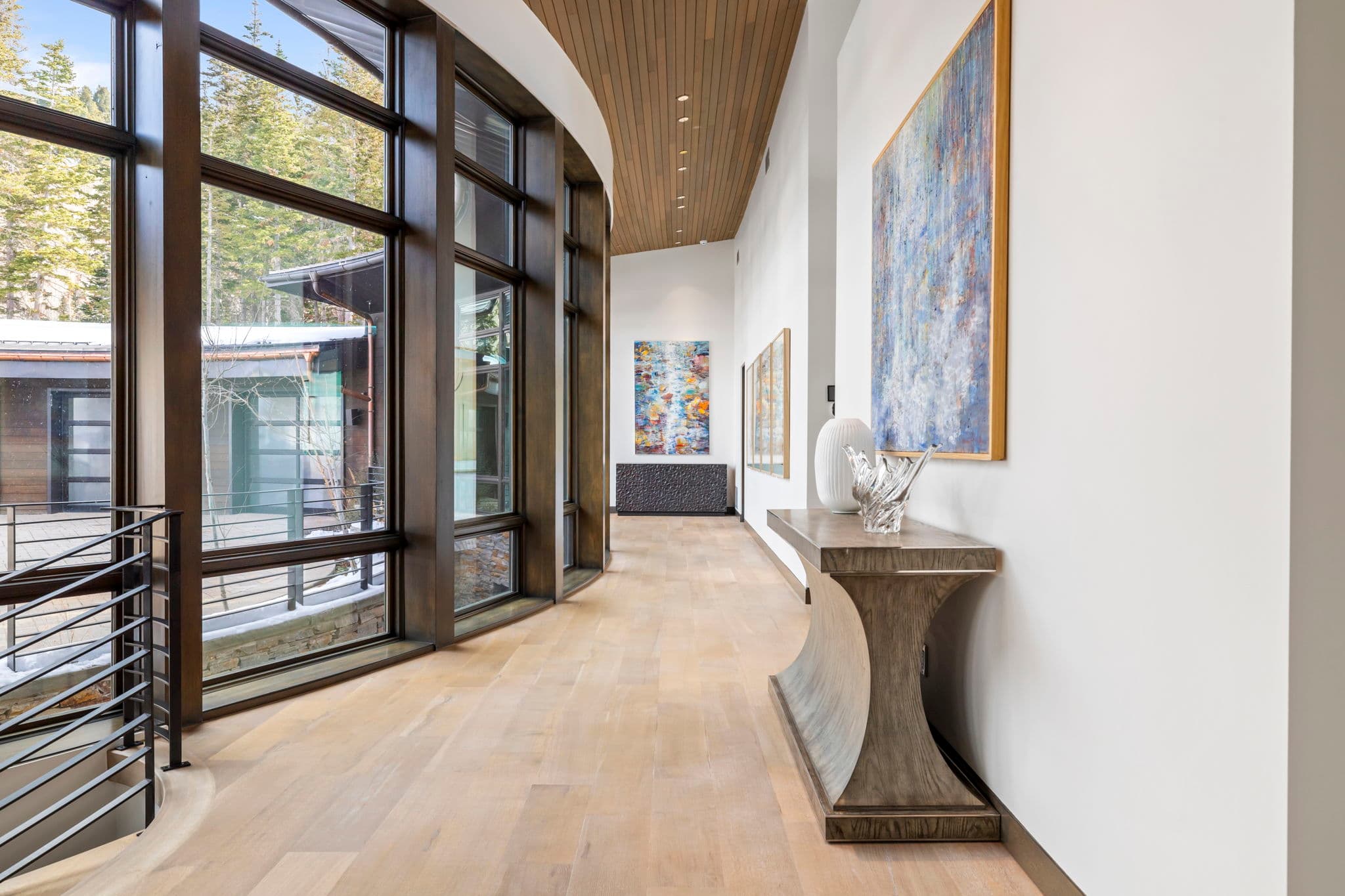 A hallway with artwork hanging on the walls.