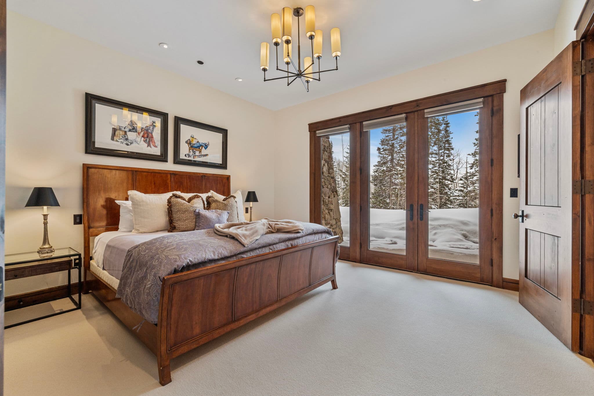 another guest suite with mountain views and chandelier with stunning wall art