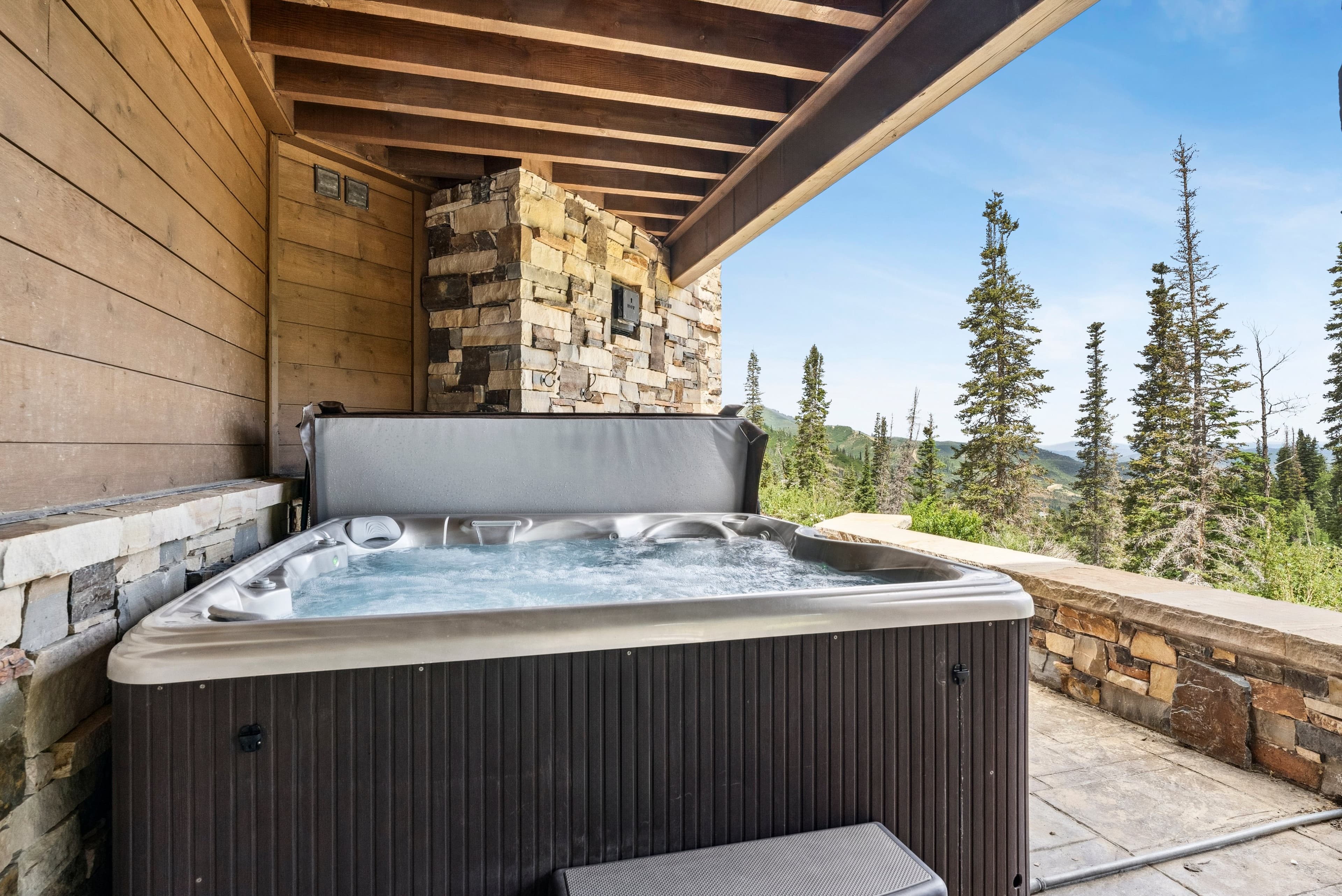 hot tub located on one of the balconies with ski run views